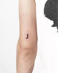 Tiny Letter J Tattoo By Gianina Caputo Inked Above The Left Elbow J Tattoo Minimal Tattoo Tiny Tattoos