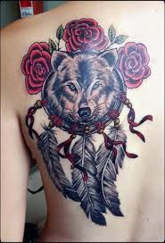 Rosebuds, blooming roses, flowers, hearts, birds and wings emphasize femininity. Tattoo Totem Free Dreams 3 Wolf Tattoos Wolf Dreamcatcher Tattoo Dream Catcher Tattoo Design