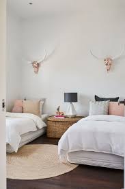 This deep purple wall color is paired wonderfully with neutral pieces, such as the white canopy bed, furniture, glass lamps; Rose Gold Bedroom Ideas And Photos Houzz