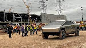 Choose the dual motor model and range drops to 300 miles, while the. Elon Musk Drives Tesla Cybertruck At Upcoming Gigafactory Texas Times Of India
