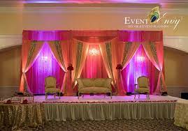 Red And Pink Toned Colors Intermingled With Magenta And Purple Lighting Indianwedding Brightandbold Purple Lighting Wedding Stage Decorations Wedding Stage