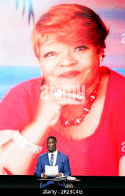 Pastor Les Robinson delivers a Mothers Day sermon as an image of his mother  Janet Shankle, who died in 2022, flashes