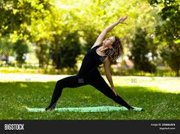 Exclusive discounts for five parks yoga su. Woman Practices Yoga Image Photo Free Trial Bigstock
