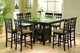 The seats are covered with the cream pillows to guarantee the usage comfort. High Kitchen Table With Stools Ideas On Foter