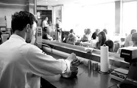 Justin is guarded by muscular men, but peaks out of his car to have a conversation with a photographer. E Baldi Ristorante
