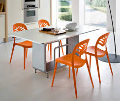 dining table with orange chairs