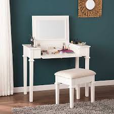 A vanity set features a mirror, table and stool to comfortably do your makeup or tie a tie before heading out the door. White Vanity Desk With Stool And Power Outlet Kirklands