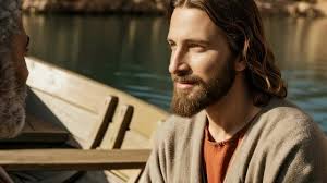 A man with long hair sits in a boat by a river, portraying Jesus teaching  biblical truths to an apostle, spiritual footage.