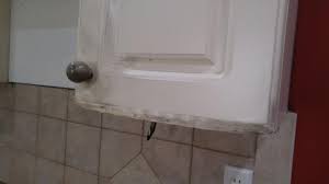 When moisture in the bathroom or kitchen causes the laminate facing to come off one of the cabinet doors, the first thing to check is the condition of the core. Fix Kitchen Cabinets Damaged Due To Fire Home Improvement Stack Exchange