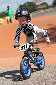 Staying Safe With Strider Knee Pads All The While Doing Fancy Tricks Best Kids Bike Strider Bike Kids Bike