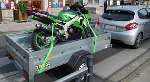 Place your motorcycle on it's kickstand. How To Tie Down Motorcycle With Ratchet Straps