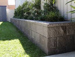 Heavy material such as big retaining wall blocks, timbers or poured concrete is needed to stop any collapsing and counteract the pressure. Versawall Blocks Cost Adelaide Versawall Blocks Price Australian Paving Centre Landscaping Retaining Walls Front Garden Design Backyard Landscaping Designs