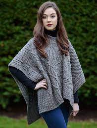 Knitted drops poncho in garter st with lace pattern and buttons in the side, worked top down in brushed alpaca silk. V Neck Aran Cable Poncho Knitted Poncho Knitted Irish Sweater