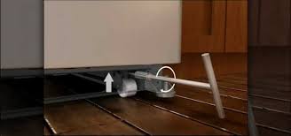 In some kitchens, reversing the direction of the door swing can eliminate collisions between the refrigerator door and the wall. How To Align The Doors To A Fridge With Adjustable Rollers Home Appliances Wonderhowto