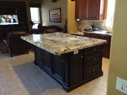 Home styles kitchen island is constructedhome styles kitchen island is constructed of solid hardwoods and engineered wood with a rich white stylish design features include a solid hardwood, distressed oak finished top with profiled edges and a black granite inset; Pin On Granite
