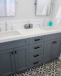 White Subway Tile White Counter And Gray Blue Vanity With Neutral Walls Girlsbathroom Vanity Backsplash White Subway Tile Bathroom Bathroom Cabinets Designs