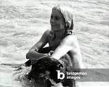 Image of The French actress Catherine Deneuve bathing in the sea ...