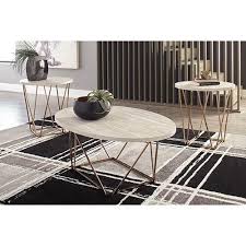 Swirls of metal accents add a lovely dimension under a beveled glass inset tabletop. Signature Design By Ashley Tarica Coffee Table Set