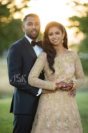 Indian Wedding Bride And Groom In Reception Look Gold And Peach Bridal Gown Jsk Photography Bridal Gowns Indian Wedding Bridesmaid Dresses