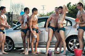 Naked men washing cars