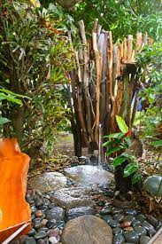 Outdoor, shrubs, grass, trees, and back yard. Indoor Outdoor Showers Tropical Garden Hawaii By Natural Structures Houzz Uk