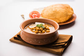 It is a combination of chana masala (spicy white chickpeas) and bhatura/puri, a fried bread made from maida. Chole Bhature Stock Photos And Images 123rf