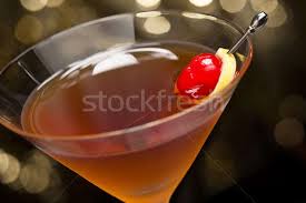 Stirring the cocktail is a more delicate way of blending the liquids and still effectively cools the drink without watering it down. Manhattan Cocktail Garnished With A Cherry And Lemon Stock Photo C 3523studio 1892076 Stockfresh
