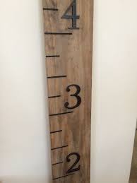 diy rustic growth chart using mixed stain house numbers