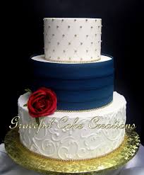 Elegant Ivory Butter Cream Wedding Cake With Navy Blue Pleats And Gold Sugar Pearls And Bling Accents Cream Wedding Cakes Wedding Cake Toppers Wedding Cake Topper Silhouette