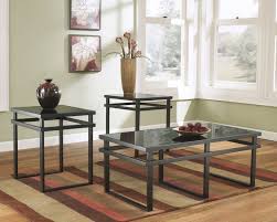 Highlighted by unique x pattern accents and an authentic washed gray finish with aged bronze hardware, this table set is a natural fit in homes that embrace cottage and farmhouse styling. T180 13 3 Pc Laney Collection Black Matte Finish Metal And Glass Top Coffee And End Table Set