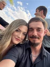 Hi. Hopefully someone can work their magic. This is my husband and I front  left. Is someone able to please take out the others to the side and rear of  us. Will