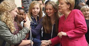 Take a look at the the german. In The Words Of Young Germans Just Merkeln Politico