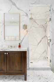 Available in slab and tiles, this versatile material is perfect for countertops, bathroom vanities, flooring, wall cladding, and so much more picture courtesy. Artistic Tile I This Luxe Brooklyn Townhouse Was Tiled With 25 Slabs Of Calacatta Go Calcutta Gold Marble Bathroom White Marble Bathrooms Bathroom Decor Luxury
