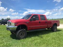 Early 1999 Ford F-350 Crew Cab Long bed 7.3 L Powerstroke turbo diesel.  Bhaf intake, MBRP stainless straight pipe exhaust with Edge CTS3. Double  Din headunit with kicker front door speakers(rears not