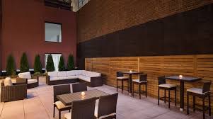 Proudly ranked top 20 hotels in new york city. Tables And Sofa On Outdoor Garden Patio In The Evening Hilton Garden Inn Ny Hotel Patio Garden