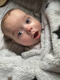 Is it okay to give a pacifier during tummy time? How long should a  2-month-old do tummy time?