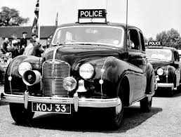 Black And White Police Car Uk 1953 Hmi Inspection With The Birmingham City Police Austin A70 Herefords Driving Past The Rostrum With Images Police Cars British Police Cars Police