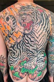 Another of the many tiger tattoos inspired by japanese art, this piece makes use of darker, subtler colors to convey a more menacing aura. Tattoo Uploaded By Craig Kelly Japanese Tiger Backpiece 1274522 Tattoodo