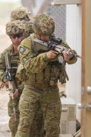 Australian Army Officer Lieutenant Benjamin Dorland Leads His Team Through An Urban Clearance Training Activity In The Lea Military Soldiers Army Military Army