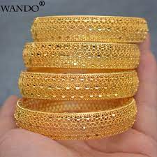 Solid gold is the most expensive and the highest in quality and purity. Buy Online Wando 4pcs Lot 24k Gold Bangles For Women Gold Dubai Bride Wedding Ethiopian Bracelet Africa Bangle Arab Jewelry Gold Charm Wb97 Alitools