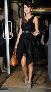 Selena Gomez Paired Her Black Cocktail Dress With Suede Ankle Boots And A Bowler Bag From Mcm A Gift From Justin Bieber