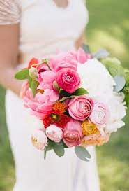 This bright bouquet of dusty miller, white snowberries, seeded eucalyptus, yellow oncidium and mokara orchids, yellow ranunculus, cream lisianthus, white garden roses, and white wax flowers was. Wedding Flowers Bouquets Wedding Flower Photos Flower Bouquet Wedding Pink Bouquet