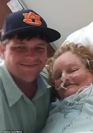 Woman who was found in wrecked car after going missing for five days smiles  from her hospital bed