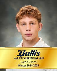 Winter 2025, Varsity Wrestling, Salah Tsarni. “Salah won a second  consecutive state title this year. He went from not placing 7th last year  at Nationals to becoming a national runner-up. Definitely a