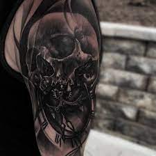 50 skull tattoo designs for men. 3d Style Very Detailed Shoulder Tattoo Of Human Skull With Clock Tattooimages Biz