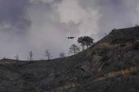 A helicopter flies overa forest fire, in the larnaca mountain region, saturday, july 3, 2021. Uh5hsw D8 63m