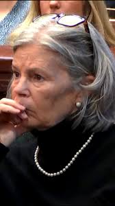 After being found guilty of her husband's murder, Melody Farris removes  pearls in court room