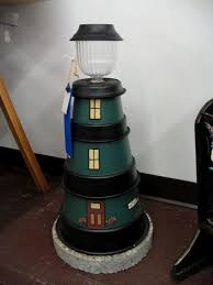 We now make the rock base with a hollow portion so you can cover a pipe or hide an unsightly well cap. 100 Diy Lighthouses Nautical Ideas Lighthouse Diy Lighthouse Crafts