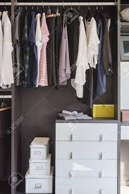 Check spelling or type a new query. Dark Color Scheme Modern Walk In Closet Design With Clothes Hanging Stock Photo Picture And Royalty Free Image Image 44931001