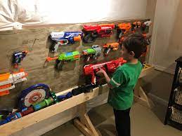 Aoanoko indoor gun rack wall mount scratchproof rubber cushion foldable hook for protection of rifle, shotgun, archery bow, 20lbs holding strength holder easily installed on wall, door, desk, shelf. D I Y Dad Projects The Nerf Gun Wall Just An Ordinary Man Trying To Be An Extraordinary Dad